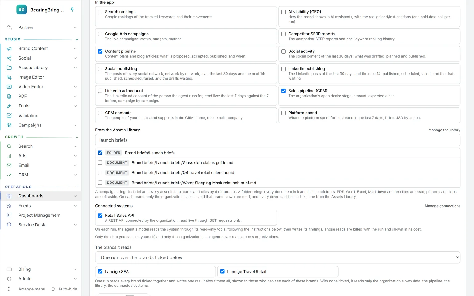 The form of the launch readiness watcher: the content pipeline, the sales pipeline, an Assets Library folder of launch briefs, and a connected retail sales API ticked, with one run over two brands